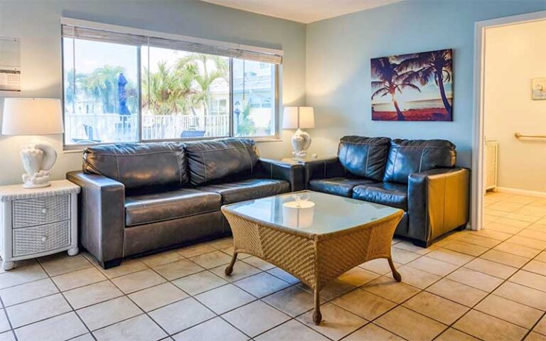 living room furnished suite with pool view at white sands beach resort holmes anna maria island