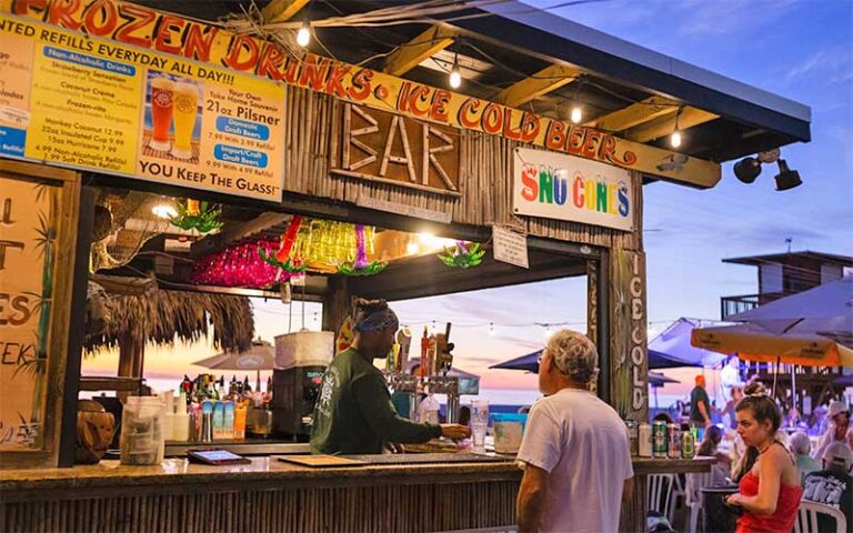 outdoor tiki bar with twilight sky at anna maria island beach cafe