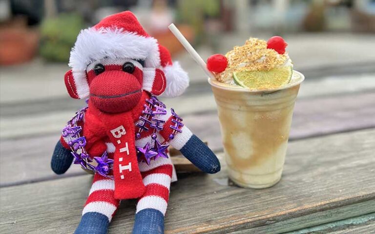 plush monkey mascot with ice cream cocktail at bridge tender inn bradenton beach anna maria island