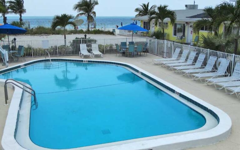 pool area with loungers and beach view at white sands beach resort holmes anna maria island