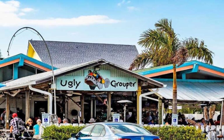 restaurant exterior with sign and entrance at the ugly grouper holmes beach anna maria island