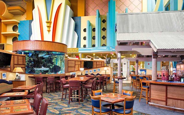 restaurant in hotel lobby with large aquarium at four points by sheraton cocoa beach