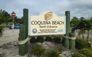 roadside entrance sign for parking at coquina beach bradenton anna maria island