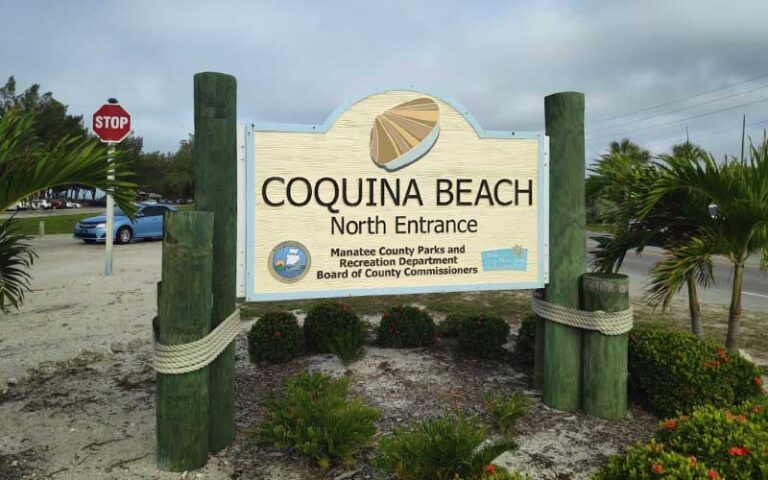 roadside entrance sign for parking at coquina beach bradenton anna maria island