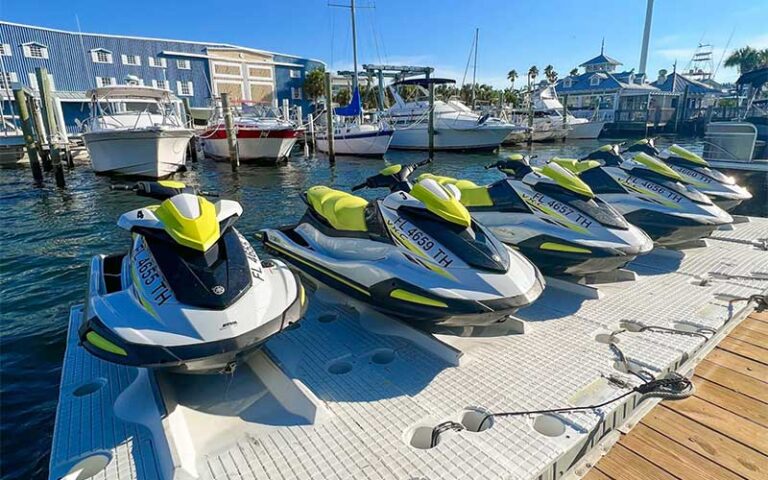 row of jet skis in marina with boats at bradenton beach marina anna maria island