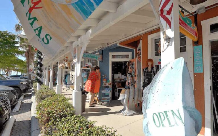 rows of shops with covered sidewalk at historic bridge street bradenton beach anna maria island