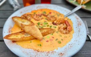 shrimp bisque with bread at the ugly grouper holmes beach anna maria island