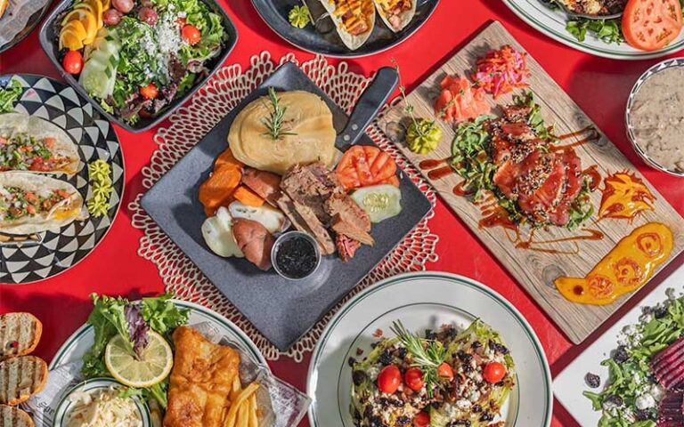 tabletop with several entrees of british irish foods at freckled fin irish pub holmes beach anna maria island