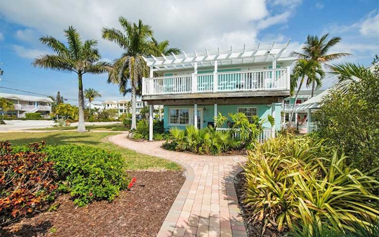 two story cabana style building with landscaping at anna maria island inn bradenton beach