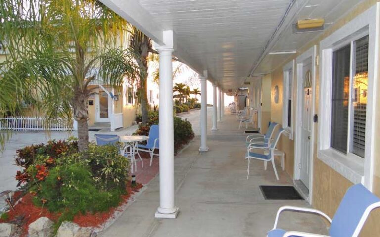 veranda with seating and palms at white sands beach resort holmes anna maria island