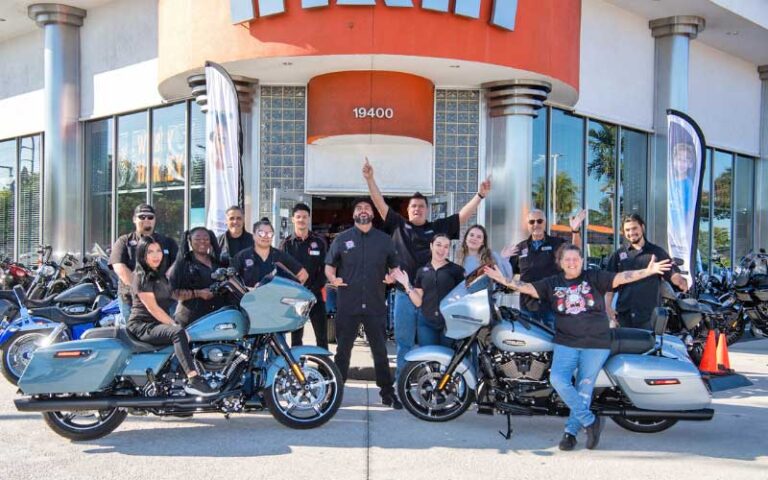 group of staff posing outside of dealership at petersons harley davidson miami